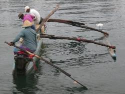 Very narrow outrigger canoe in Galle Harbour